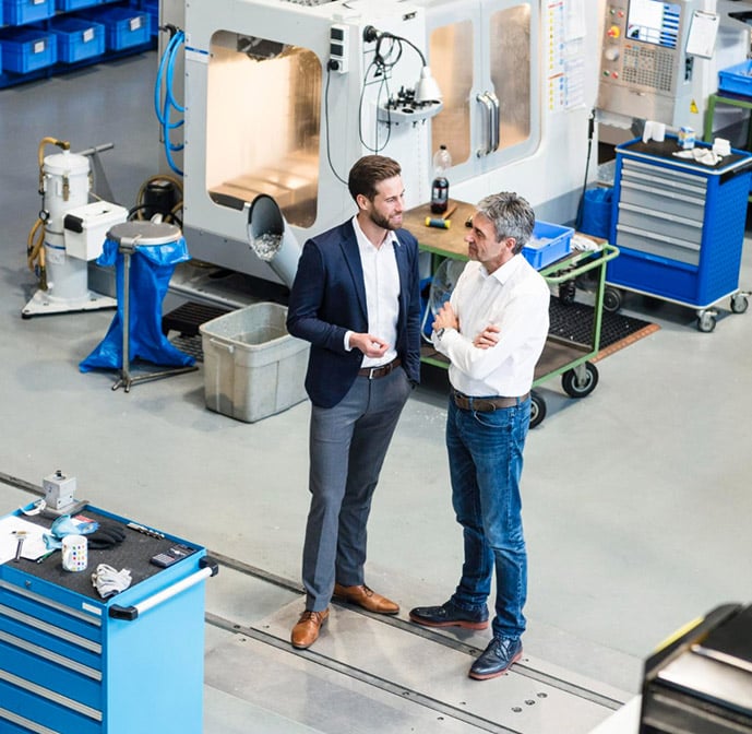 Factory CEO's discussing in factory