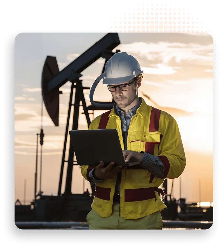 De-risk Migrations - User on laptop in oil field